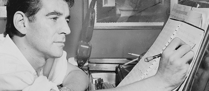 Leonard Bernstein pictured at the piano